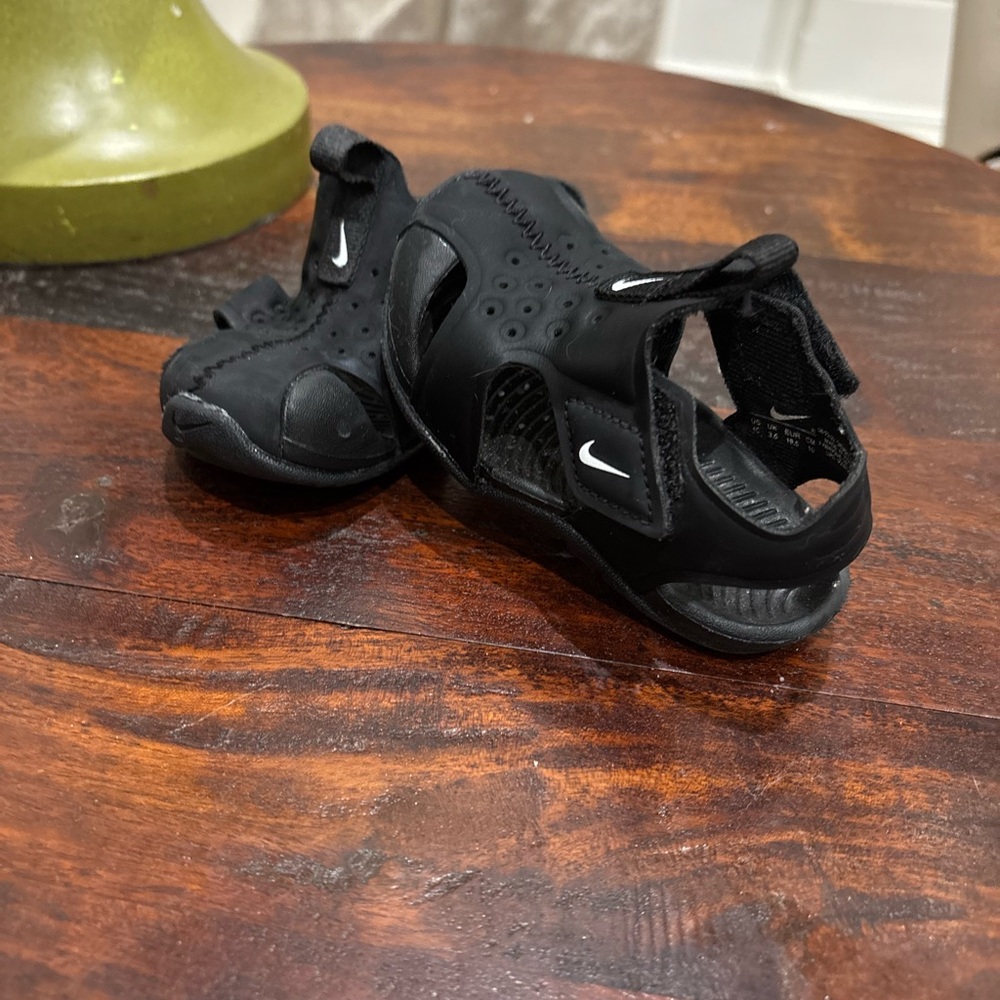 Nike Kids Black Open-Toe Sandals small tear